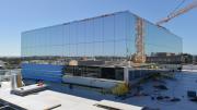 A large square on a top of a building with mirrored square finishing reflects the landscape around it.